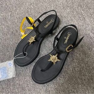 CHANEL Black Sandals with Gold Star Details